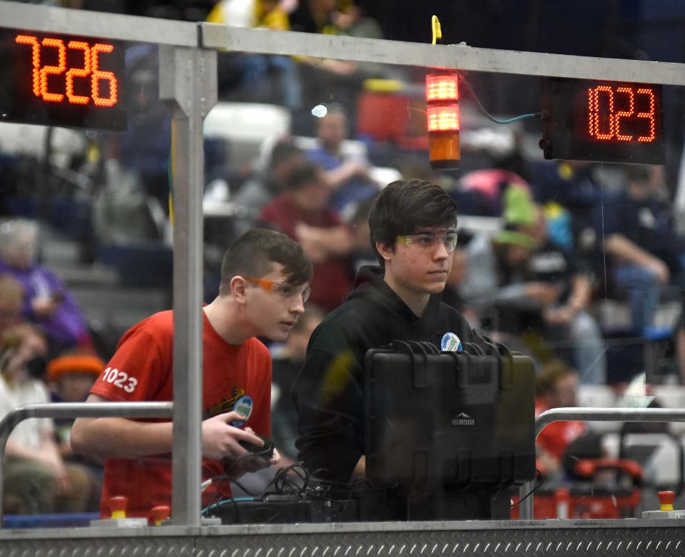 Bedford Express FRC Team #1023 robotics drive team manipulator Ryan Marckel and electronic lead and chassis driver Eric Koenemann compete in the qualifying rounds FIRST in Michigan State Championship 2024 at Saginaw Valley State University April 5, 2024.
