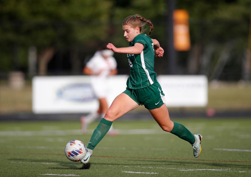 Williamston's Ashley Stover races down the pitch against Grosse Ile, Thursday, June 8, 2023, at Lansing Catholic High School.