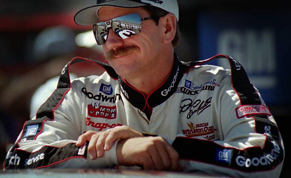 Seven-time Winston Cup champion Dale Earnhardt leans on the roof of his Chevrolet Monte Carlo on Sept. 29, 1995. Earnhardt nicknamed Jeff Gordon “Wonder Boy” early in Gordon’s career, and the two had a strong rivalry throughout the 1990s.