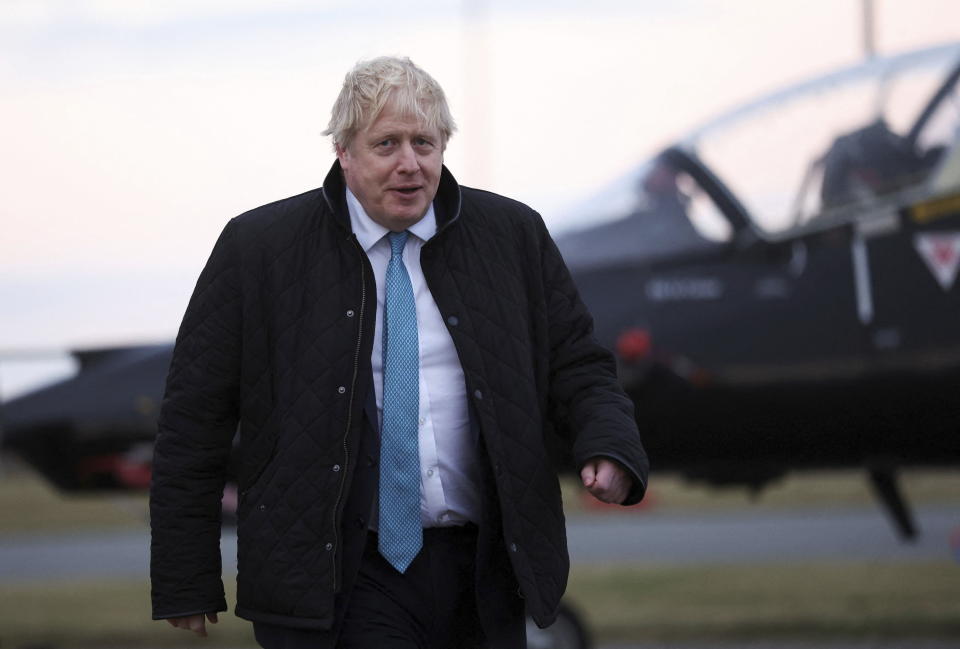 Britain's Prime Minister Boris Johnson looks on, during a visit to RAF Valley, in Anglesey, North Wales, Thursday, Jan. 27, 2022. (Carl Recine/Pool Photo via AP)