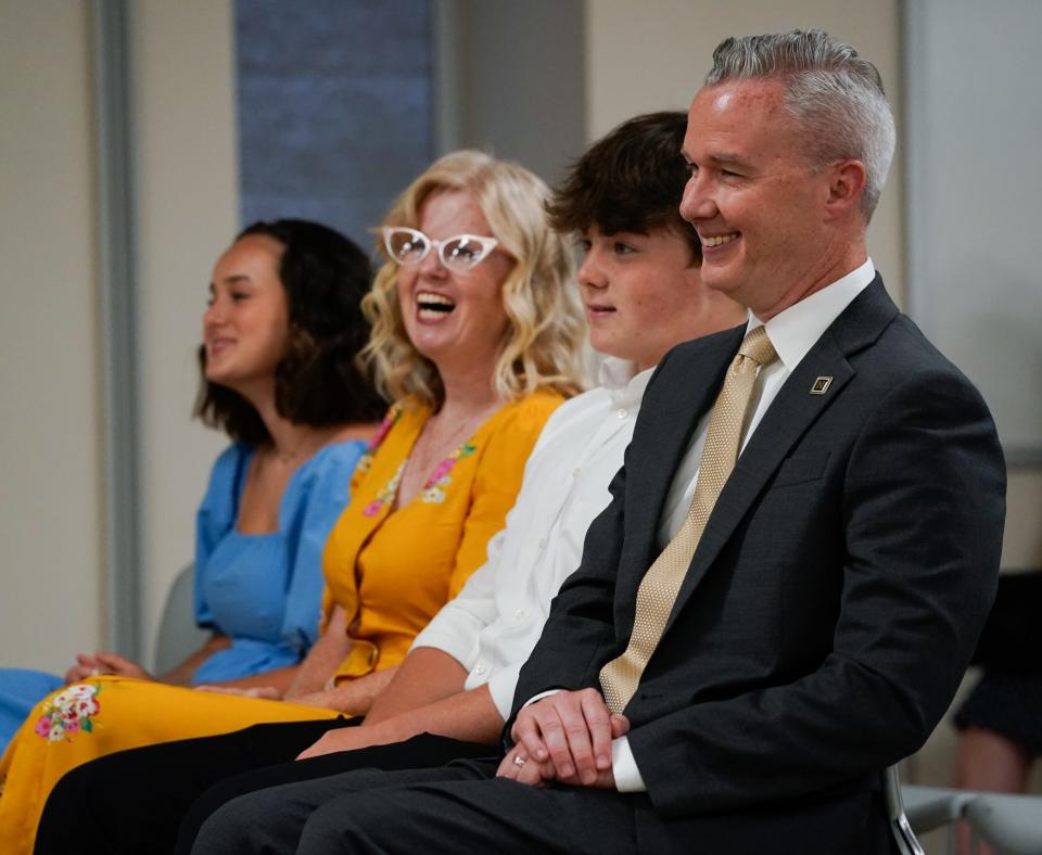 The Noblesville School Board votes to hire Daniel Hile, far right, as the new Superintendent during a meeting on Wednesday, June 15, 2022, at the Noblesville Schools Educational Services Center in Noblesville Ind. From left, Lillian, Jana, Luke, and Daniel Hile.