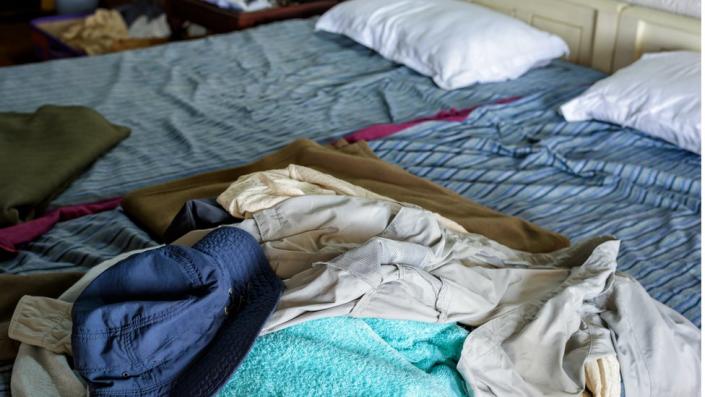 Scruffy bedroom with lots of beds