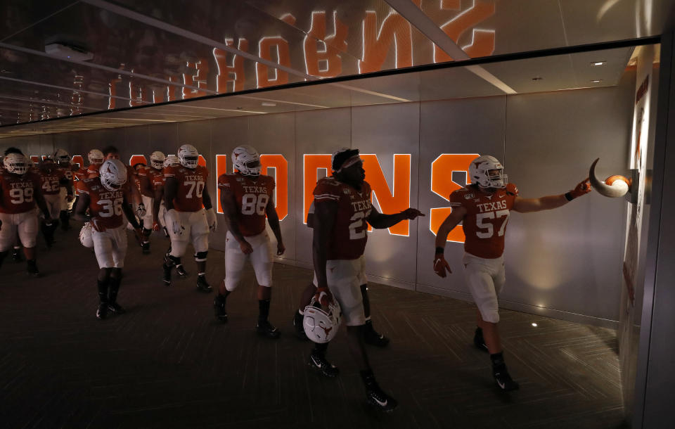 Members of the Texas Longhorns touch the longhorns as they walk to the field after half time during the game against LSU Tigers Saturday Sept. 7, 2019 at Darrell K Royal-Texas Memorial Stadium in Austin, Tx. ( Photo by Edward A. Ornelas )