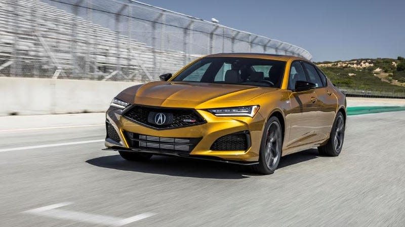 A yellow 2023 Acura TLX.