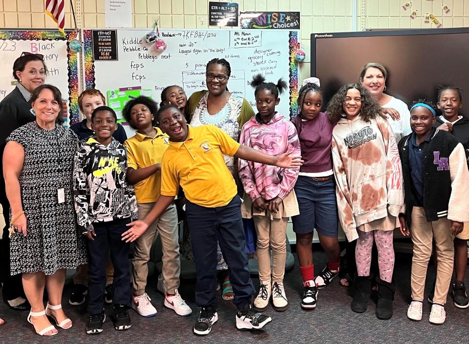 Students at Booker Elementary School celebrate a grant for their teacher from Church of the Redeemer in downtown Sarasota. Redeemer recently surprised 60 public school teachers in Sarasota-Manatee with a total of $15,000 in grants for classroom enhancements of their choice. It is the second year Redeemer has provided the gifts through its St. Scholastica Program, funded in part by parishioners. “Teachers pour their hearts and sometimes their own funds into their classrooms, and we’re thankful to be able to honor them,” Youth Minister Jackie Overton said. The teachers will be honored on April 23 at Church of the Redeemer.