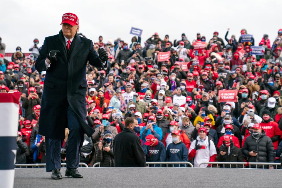 Donald Trump dances as he walks off stage after speaking during a campaign rally at Michigan Sports Stars Park, Sunday, Nov. 1, 2020, in Washington, Mich. (AP Photo/Evan Vucci)