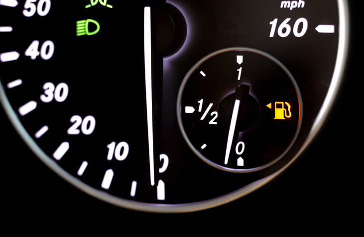 Speedometer showing speed up to 160 mph, next to a fuel gauge with a low fuel warning light on