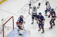 Tampa Bay Lightning center Tyler Johnson (9) celebrates his goal on New York Islanders goalie Semyon Varlamov (40) during the third period of Game 3 of the NHL hockey Eastern Conference final, Friday, Sept. 11, 2020, in Edmonton, Alberta. (Jason Franson/The Canadian Press via AP)