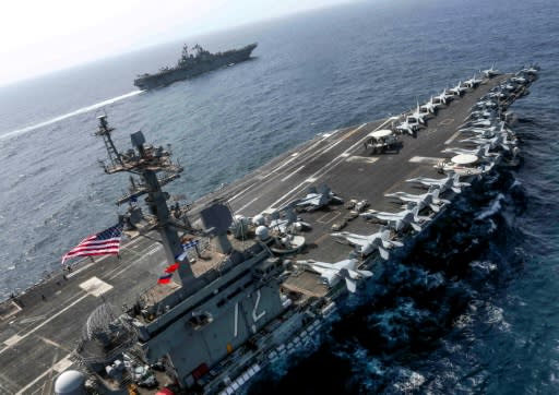 The aircraft carrier USS Abraham Lincoln and the amphibious assault ship USS Kearsarge join exercises in the Arabian Sea as President Donald Trump tries to raise pressure on Iran