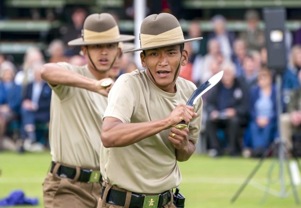 The Royal Gurkhas perform a display drill in the arena (Jane Barlow/PA) (PA Wire)