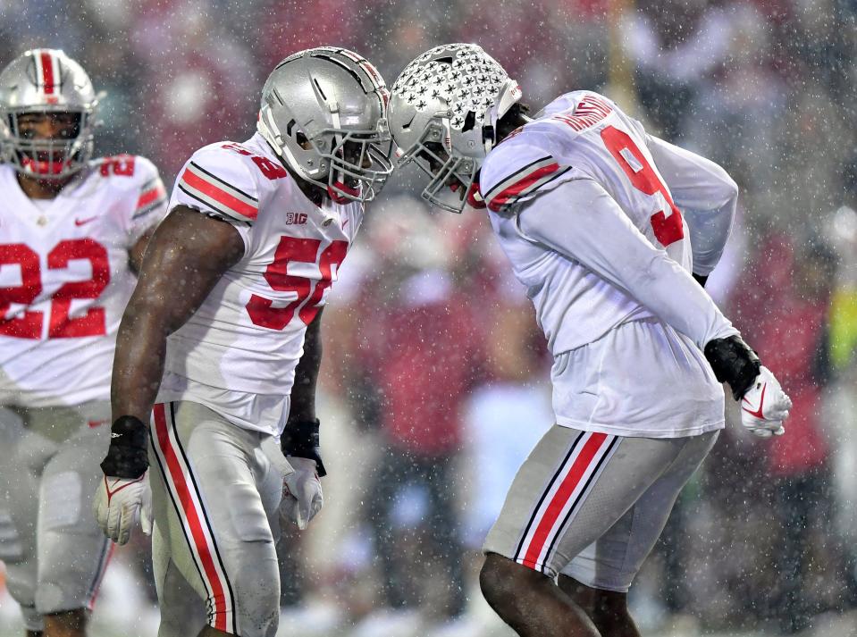 Ohio State defensive tackle Ty Hamilton celebrates with defensive end Zach Harrison after a sack in the Buckeyes' big win over Indiana.