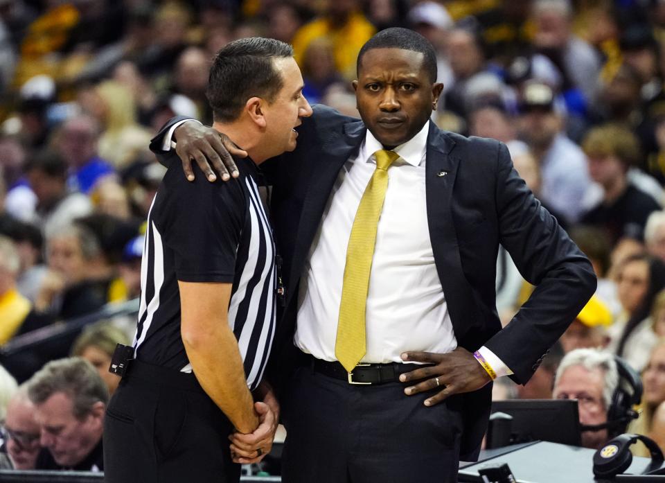 Dec 28, 2022; Columbia, Missouri, USA; Missouri Tigers head coach Dennis Gates talks with referee Rob Rorke during the first half against the Kentucky Wildcats at Mizzou Arena. Mandatory Credit: Jay Biggerstaff-USA TODAY Sports