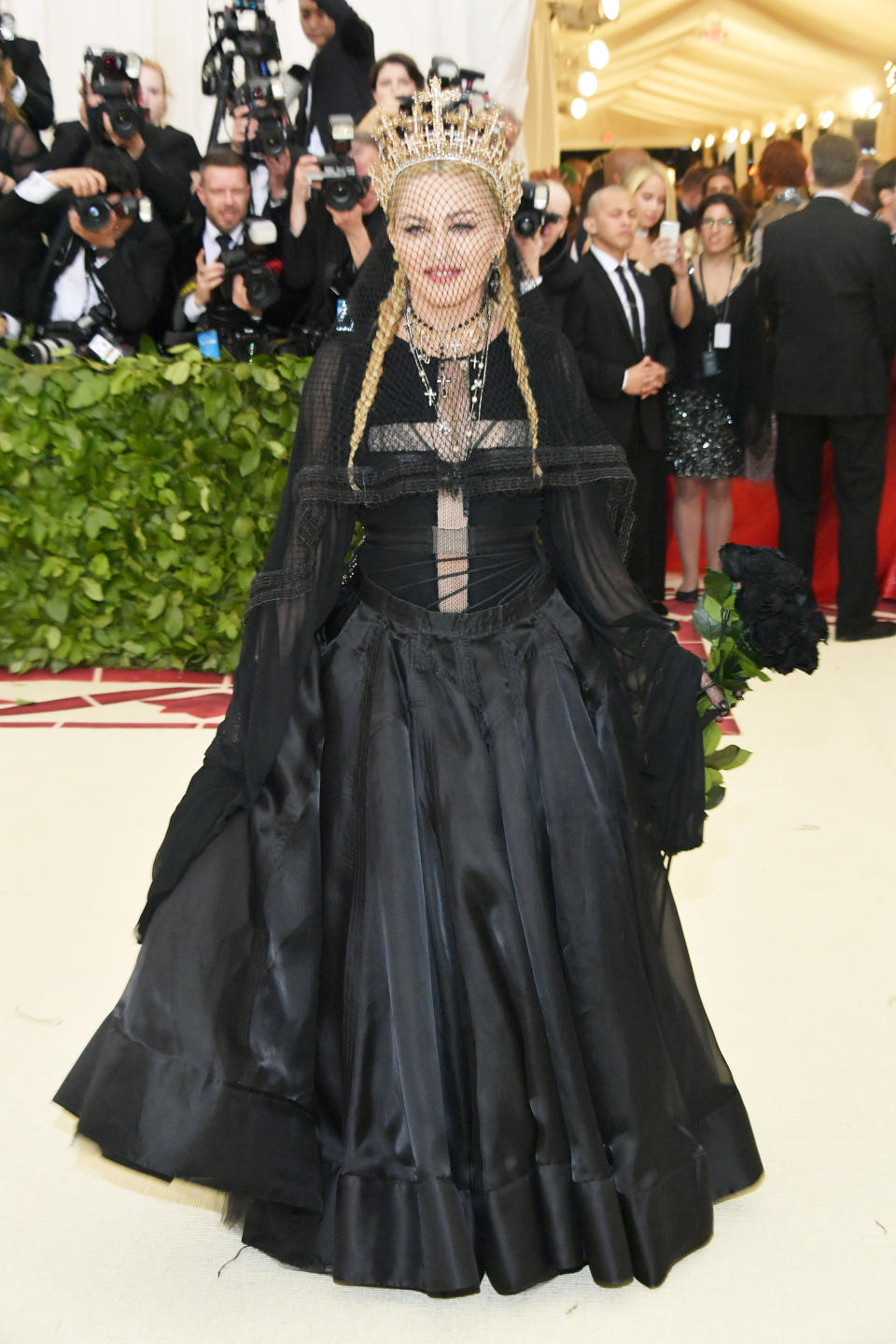 <p>Madonna took the catholic theme and ran away with it in this Jean Paul Gaultier black gown, which she matched with a gold crown. Photo: Getty Images </p>