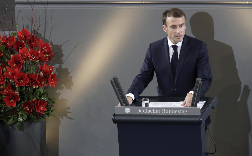 France's President Emmanuel Macron, delivers a speech during a meeting of the German Federal Parliament, Bundestag, at the Reichstag building in Berlin, Germany, Sunday, Nov. 18, 2018 during an hour of commemoration on the 'Volkstrauertag', Germany's national day of mourning. (AP Photo/Michael Sohn)