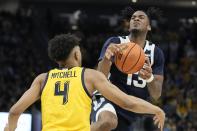 Marquette's Stevie Mitchell knocks the ball from Butler's Jayden Taylor during the second half of an NCAA college basketball game Saturday, Feb. 4, 2023, in Milwaukee. Marquette won 60-52. (AP Photo/Morry Gash)