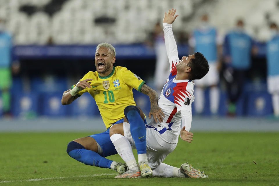 Brazil's Neymar, left, and Chile's Jean Meneses clash during a Copa America quarterfinal soccer match at the Nilton Santos stadium in Rio de Janeiro, Brazil, Friday, July 2, 2021. (AP Photo/Bruna Prado)