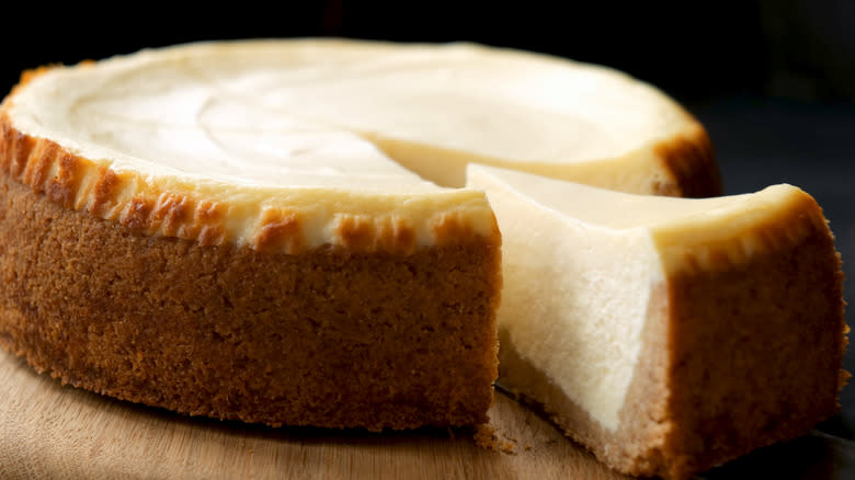 New York-style cheesecake with one slice removed