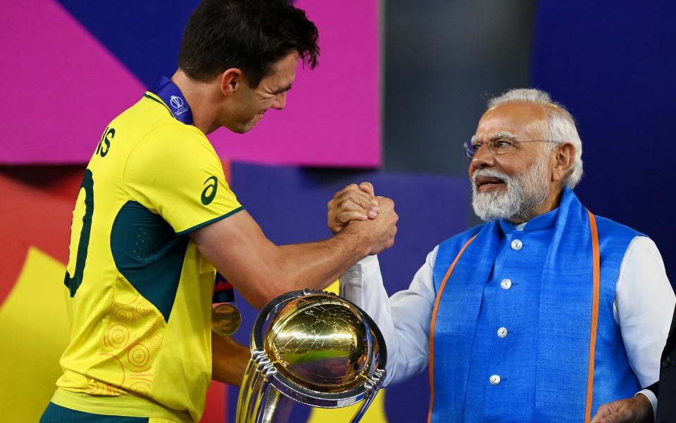 Indian prime minister Narendra Modi hands over the Cricket World Cup to Australia captain Pat Cummins