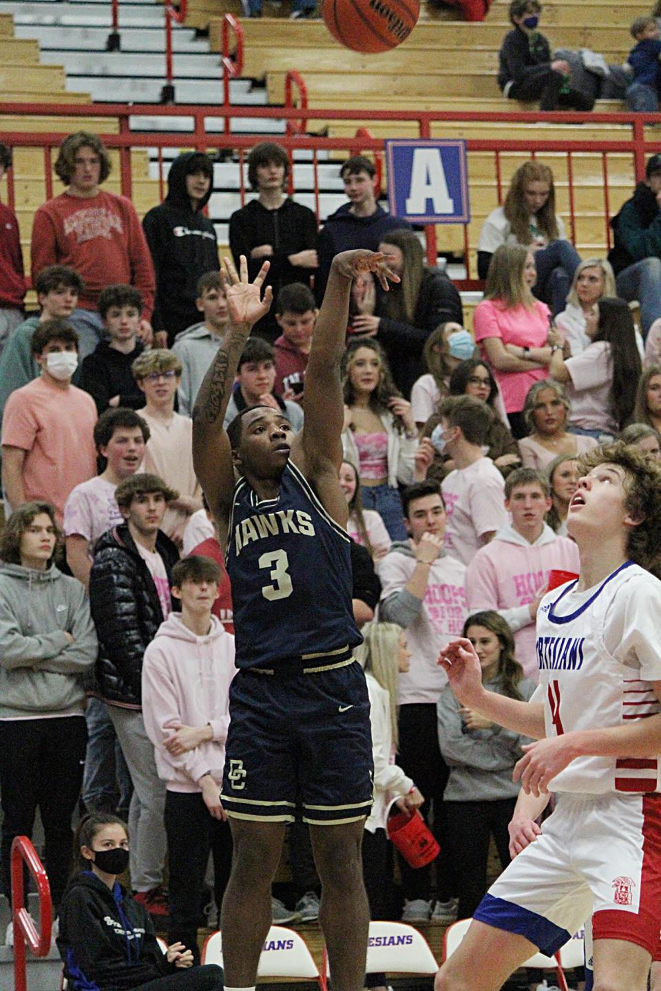 Decatur Central senior Monte'l Stone hits a 3-pointer during Friday's Mid-State Conference game against at Martinsville.