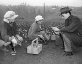 <p>Expecting evacuation to inland areas but working in the meantime, two Japanese vegetable farm women in Washington state’s Puyallup Valley are registered by William Hosohawa, right, of the Japanese-American Citizens League, March 11, 1942. The league is sponsoring the registration so American-born and alien Japanese can keep in touch with friends and relatives when they are moved. (AP Photo/Paul Wagner) </p>