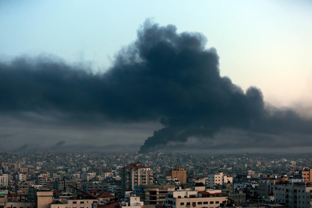 Black smoke raise from Eastern Gaza City on Thursday (AP)