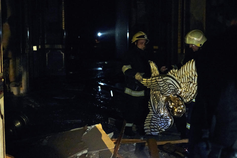 Firefighters work inside the Odesa Transfiguration Cathedral, heavily damaged in a Russian missile attack in Odesa, Ukraine, Sunday, July 23, 2023. (AP Photo/Libkos)