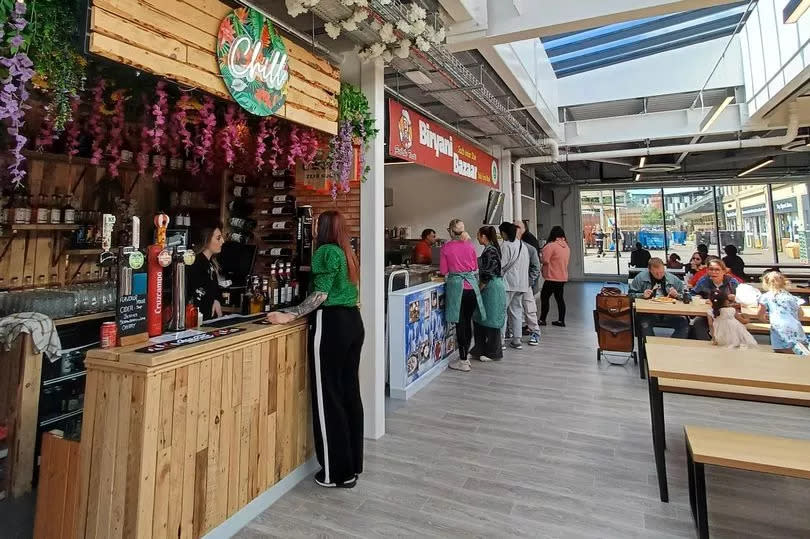 A bustling food hall has opened within Bolton Market