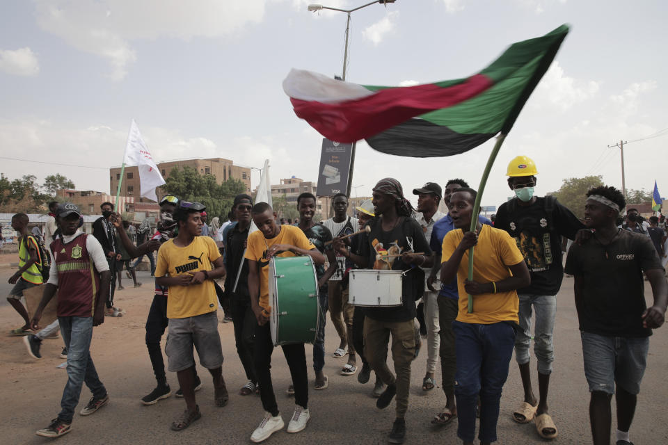 Sudanese demonstrators attend rally to demand the return to civilian rule, in Khartoum, Sudan, Thursday, Oct. 6, 2022. Sudan has been mired in political turmoil since its military seized power in a coup last October after three decades of repressive Islamist rule under former President Omar Al Bashir. (AP Photo/Marwan Ali)