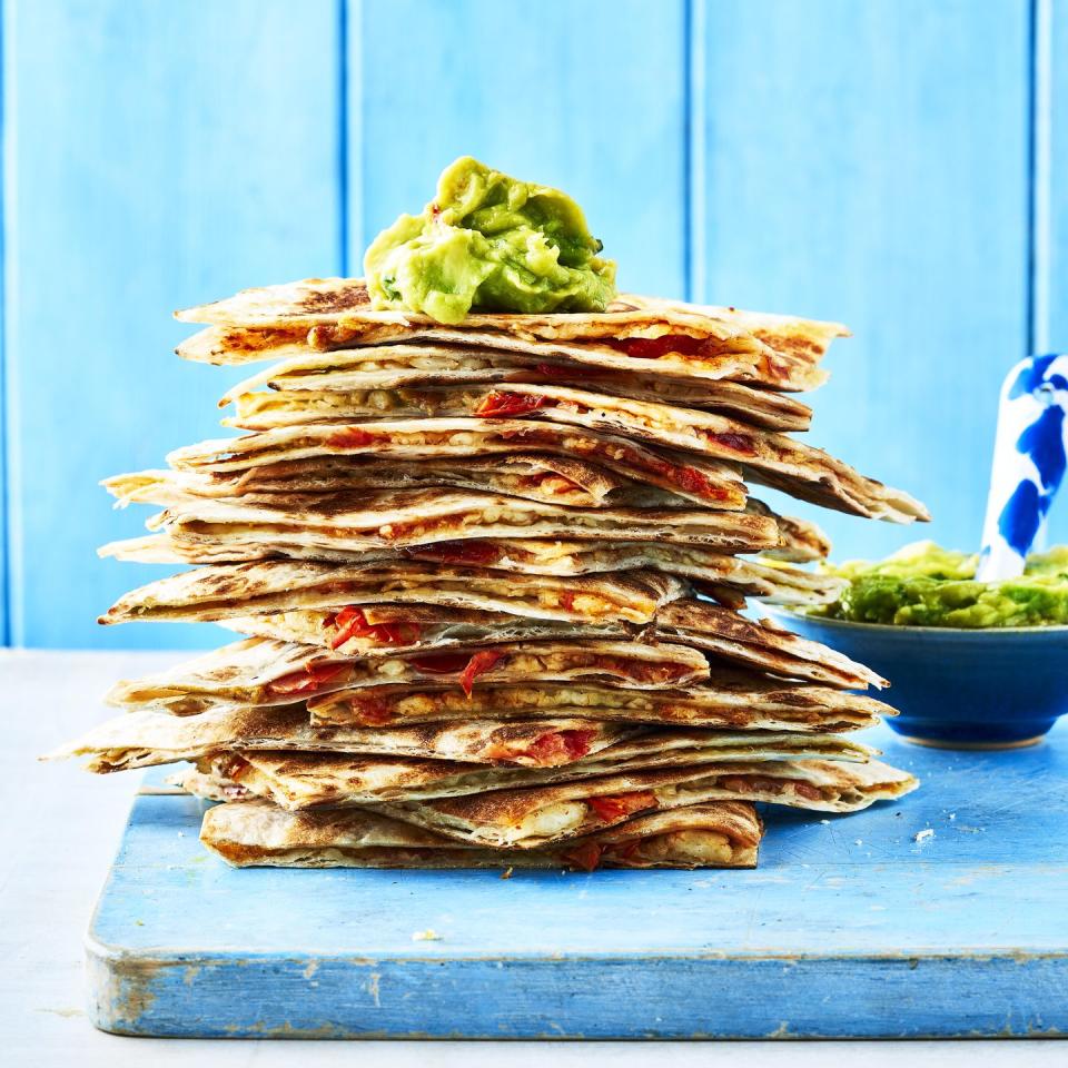 <p>Grating halloumi is a nifty way to make your cheese go further and the smaller pieces means it melts and becomes extra cheesy. We've filled ours with tomato, guacamole and halloumi - yum!</p><p><strong>Recipe: <a href="https://www.goodhousekeeping.com/uk/food/recipes/a38122797/grated-halloumi-quesadillas/" rel="nofollow noopener" target="_blank" data-ylk="slk:Grated halloumi quesadillas;elm:context_link;itc:0;sec:content-canvas" class="link ">Grated halloumi quesadillas</a></strong></p>