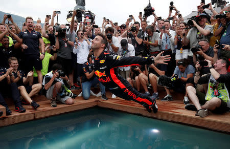 Formula One F1 - Monaco Grand Prix - Circuit de Monaco, Monte Carlo, Monaco - May 27, 2018 Red Bull's Daniel Ricciardo jumps into a pool as he celebrates winning the race REUTERS/Benoit Tessier