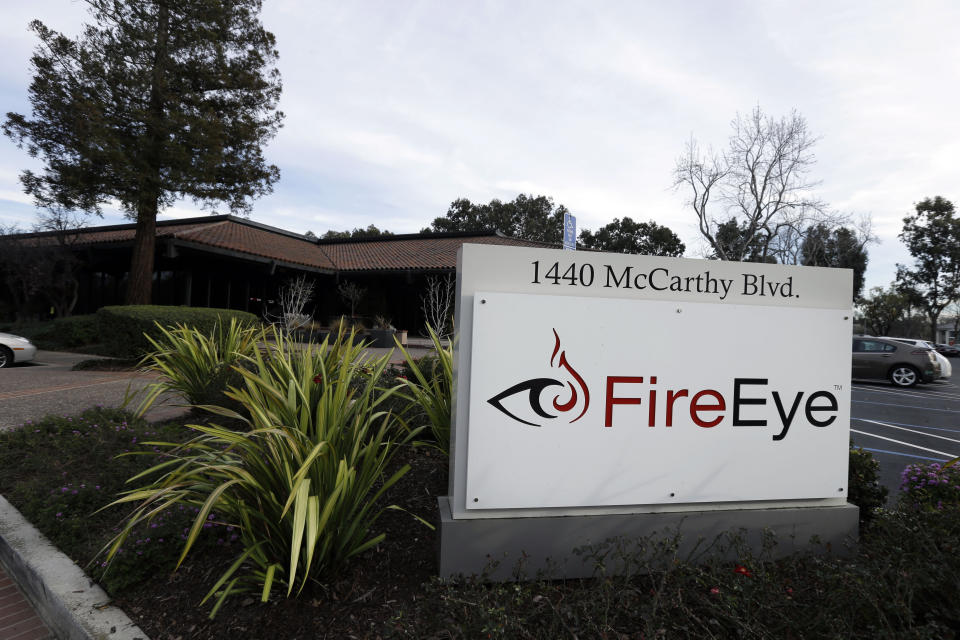 FILE - This Wednesday, Feb. 11, 2015 file photo shows FireEye offices in Milpitas, Calif. Experts say it’s going to take months to kick elite hackers widely believed to be Russian out of U.S. government networks. The hackers have been quietly rifling through those networks for months in Washington’s worst cyberespionage failure on record. FireEye is the cybersecurity company that discovered the worst-ever intrusion into U.S. agencies and was among the victims. It has already tallied dozens of casualties. It’s racing to identify more. (AP Photo/Ben Margot)