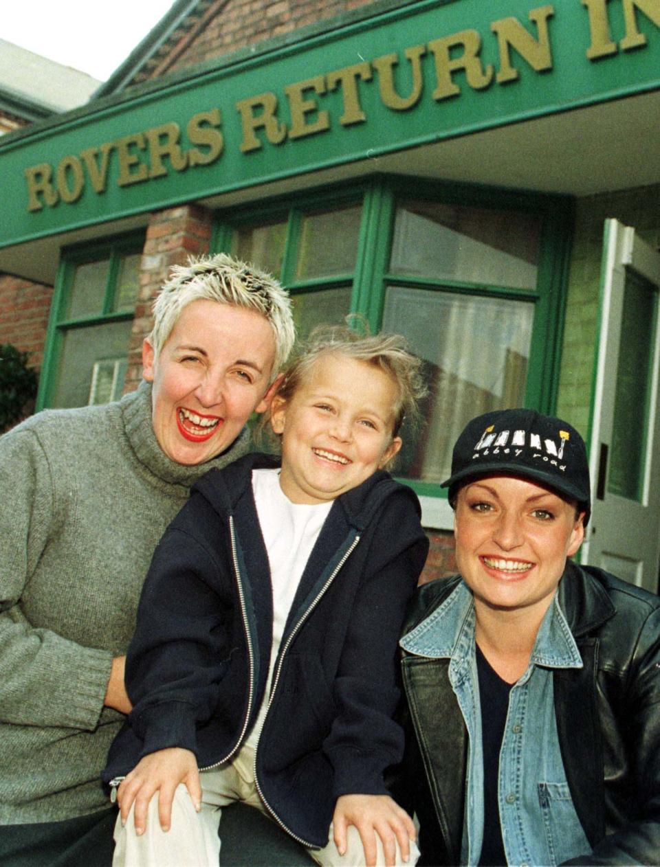 India Farmer, 6,  from North Yorkshire, who was given only months to live, celebrated the first anniversary of her life-saving transplant operation, by meeting Coronation Street stars Julie Hesmondhalgh (L) (Hayley Patterson) and Jacqui Pirie (Linda Sykes).  * at Granada studios in Manchester.   (Photo by Malcolm Croft - PA Images/PA Images via Getty Images)