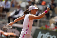 Poland's Iga Swiatek clenches her fist after scoring a point against Coco Gauff of the U.S. during their quarterfinal match of the French Open tennis tournament at the Roland Garros stadium in Paris, Wednesday, June 7, 2023. (AP Photo/Thibault Camus)