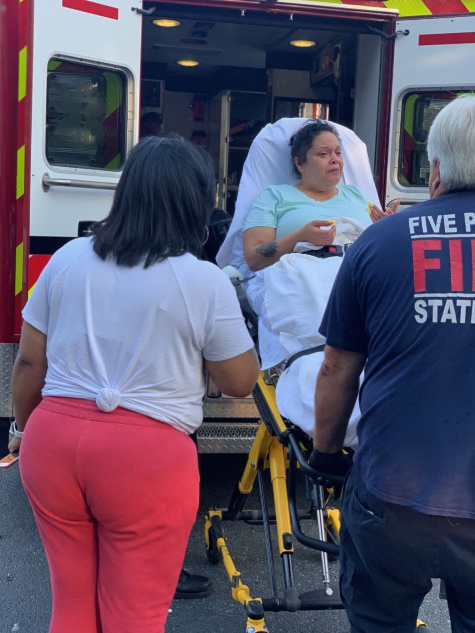 Collazo being put into an ambulance right after her daughter Amoura Rose was born in the bathroom of her sister's house in Wilmington on Aug. 25.