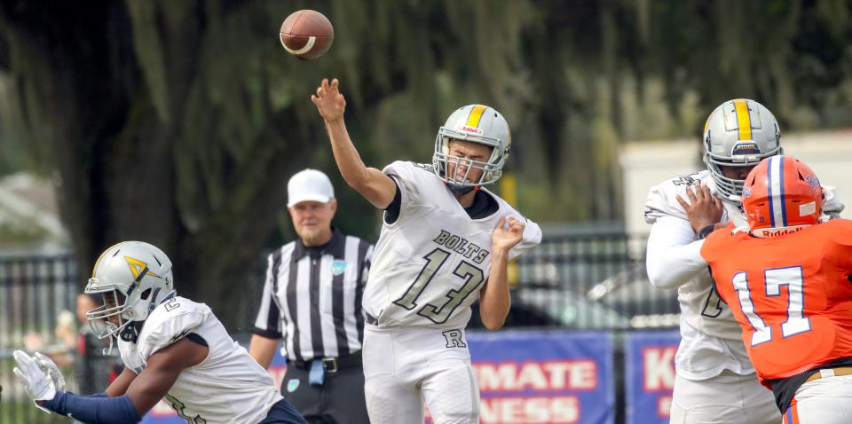 Ridge Community quarterback John Kostuch completes a pass in the firt quarter against Ridge Community on Saturday morning.