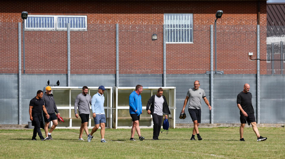 The England rugby heroes get to work on the pitch.