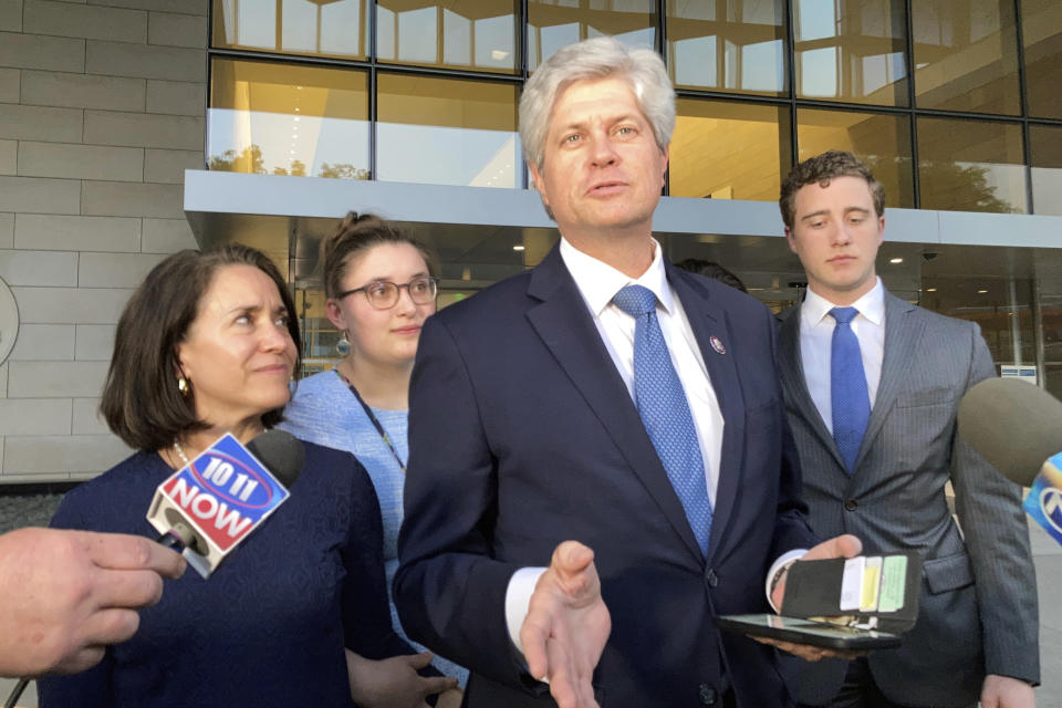 FILE - Rep. Jeff Fortenberry, R-Neb., center, speaks with the media outside the federal courthouse in Los Angeles, March 24, 2022. Fortenberry was convicted of charges that he lied to federal authorities about an illegal $30,000 contribution to his campaign from a foreign billionaire at a 2016 Los Angeles fundraiser. (AP Photo/Brian Melley, File)