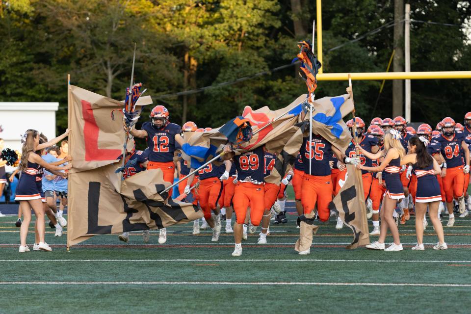 September 1, 2023; Mountain Lakes High School varsity football team breaks the banner before their first game of the season against Lenape Valley. Mountain Lakes, New Jersey, USA; Mountain Lakes High School. Mandatory Credit: Tom Salus-The Record