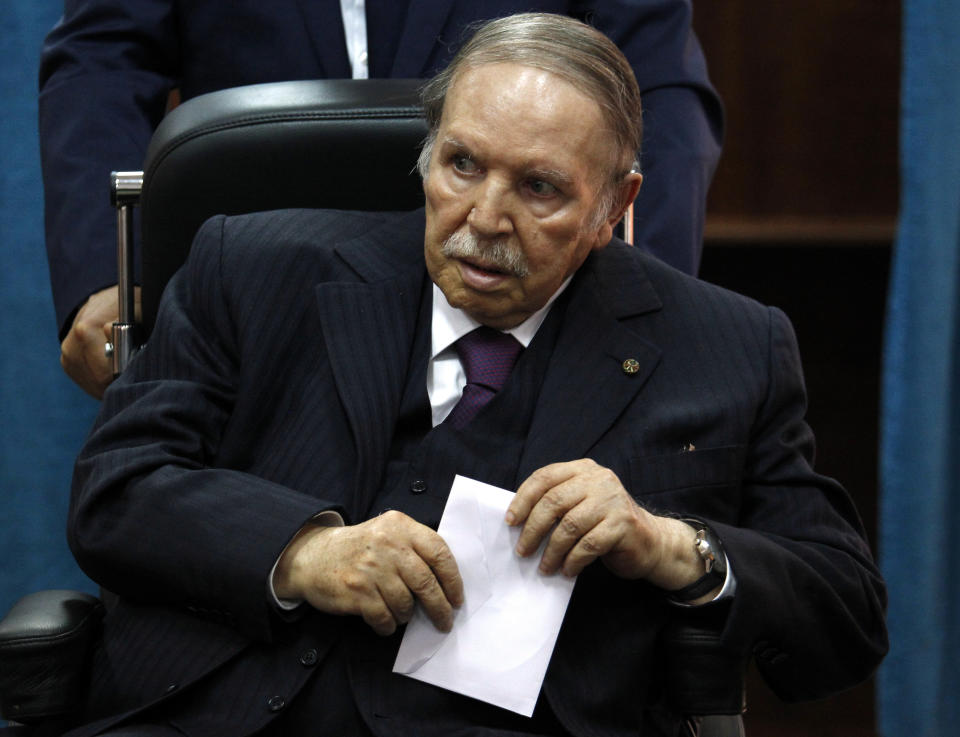 FILE - In this May 4, 2017, file photo, Algerian President Abdelaziz Bouteflika prepares to vote in Algiers. Former Algerian President Bouteflika, who fought for independence from France in the 1950s and 1960s and was ousted amid pro-democracy protests in 2019 after 20 years in power, has died at age 84, state television announced Friday, Sept. 17, 2021. (AP Photo/Sidali Djarboub, File)