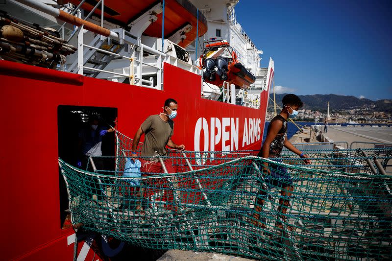 FILE PHOTO: Migrants on board Open Arms rescue boat arrive at Messina port