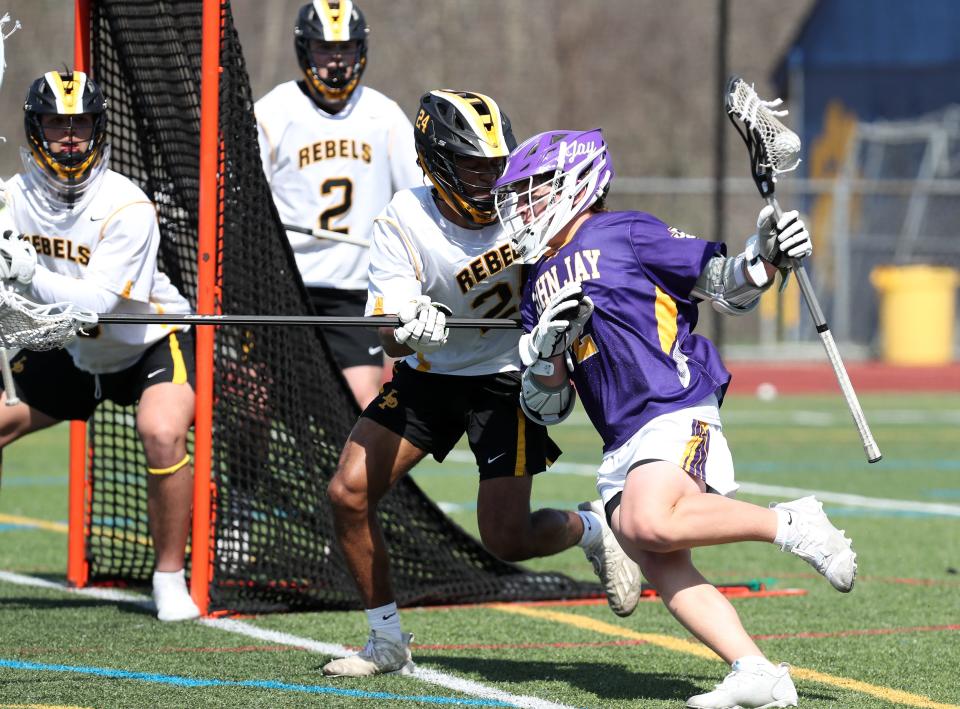 John Jay (CR) Luca Duva (2) drives to the goal against  Lakeland/Panas during boys lacrosse action at Walter Panas High School in Cortlandt April 14, 2022. John Jay (CR) won the game 13-5.