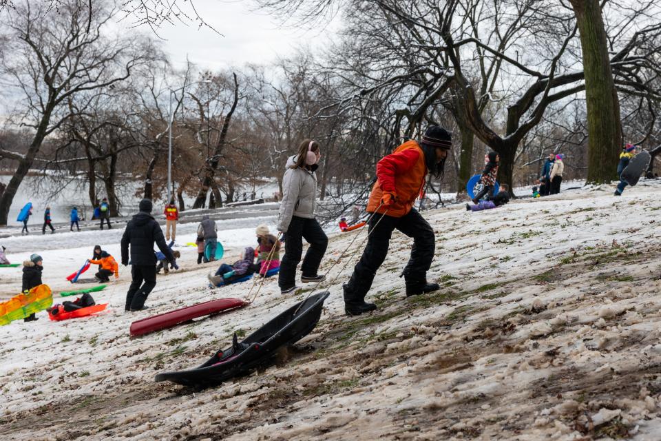 Children sled at a hill in Brooklyn’s Prospect Park as the snow began to turn to slush (Getty Images)