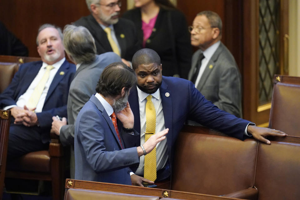Rep. Byron Donalds, R-Fla., talks with colleagues in the House chamber after six failed votes to elect a new speaker, and a motion to adjourn for the day, in Washington, Wednesday, Jan. 4, 2023. (Alex Brandon / AP)