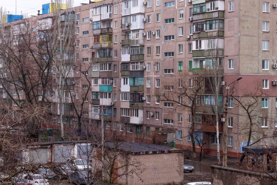 Mariupol, Donetsk region, Ukraine, urban landscape with a multi-story residential building.