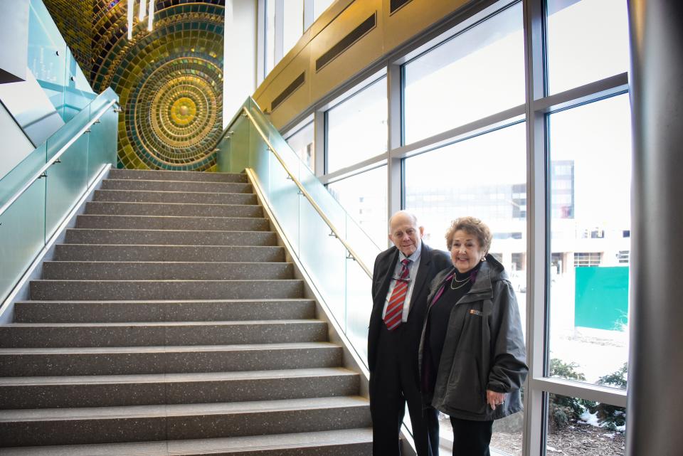 Jim and Judith Herbert, both 81, pose for a portrait in the lobby of Sparrow Herbert-Herman Cancer Center in Lansing.