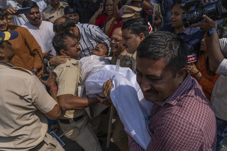 Police detains a member of opposition Congress party during a protest demanding an investigation into allegations of fraud and stock manipulation by India's Adani Group outside National Stock Exchange in Mumbai, India, Wednesday, March 1, 2023. The Adani Group suffered a massive sell-off of its shares after a U.S.-based short-selling firm, Hindenburg Research, accused it of various fraudulent practices. The Adani Group has denied any wrongdoing. (AP Photo/Rafiq Maqbool)