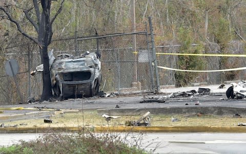 A view of a damaged vehicle near the site of a plane crash near Feu Follet Road and Verot School Road in Lafayette, La. - Credit: Scott Clause&nbsp;/The Daily Advertiser&nbsp;