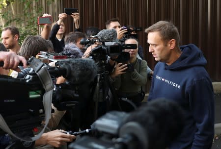 Russian opposition leader Navalny speaks with journalists outside a detention centre in Moscow