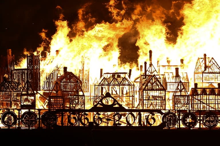 A replica of 17th-century London on a barge floating on the river Thames burns in an event to mark the 350th anniversary of the Great Fire of London, in London on September 4, 2016