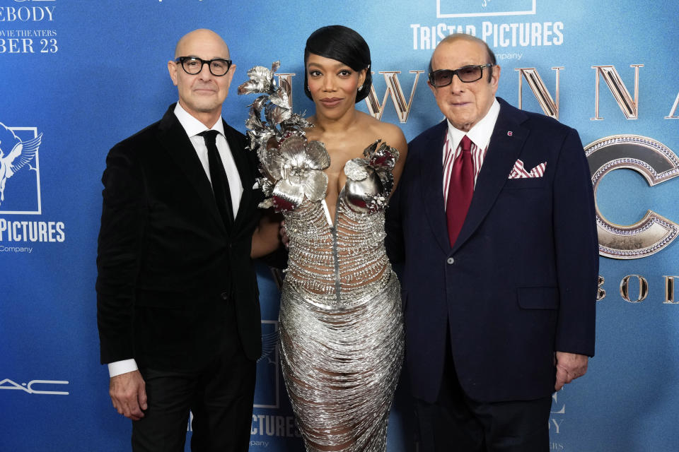 Stanley Tucci, left, Naomi Ackie and Clive Davis attend the world premiere of "Whitney Houston: I Wanna Dance with Somebody" at AMC Lincoln Square on Tuesday, Dec. 13, 2022, in New York. (Photo by Charles Sykes/Invision/AP)